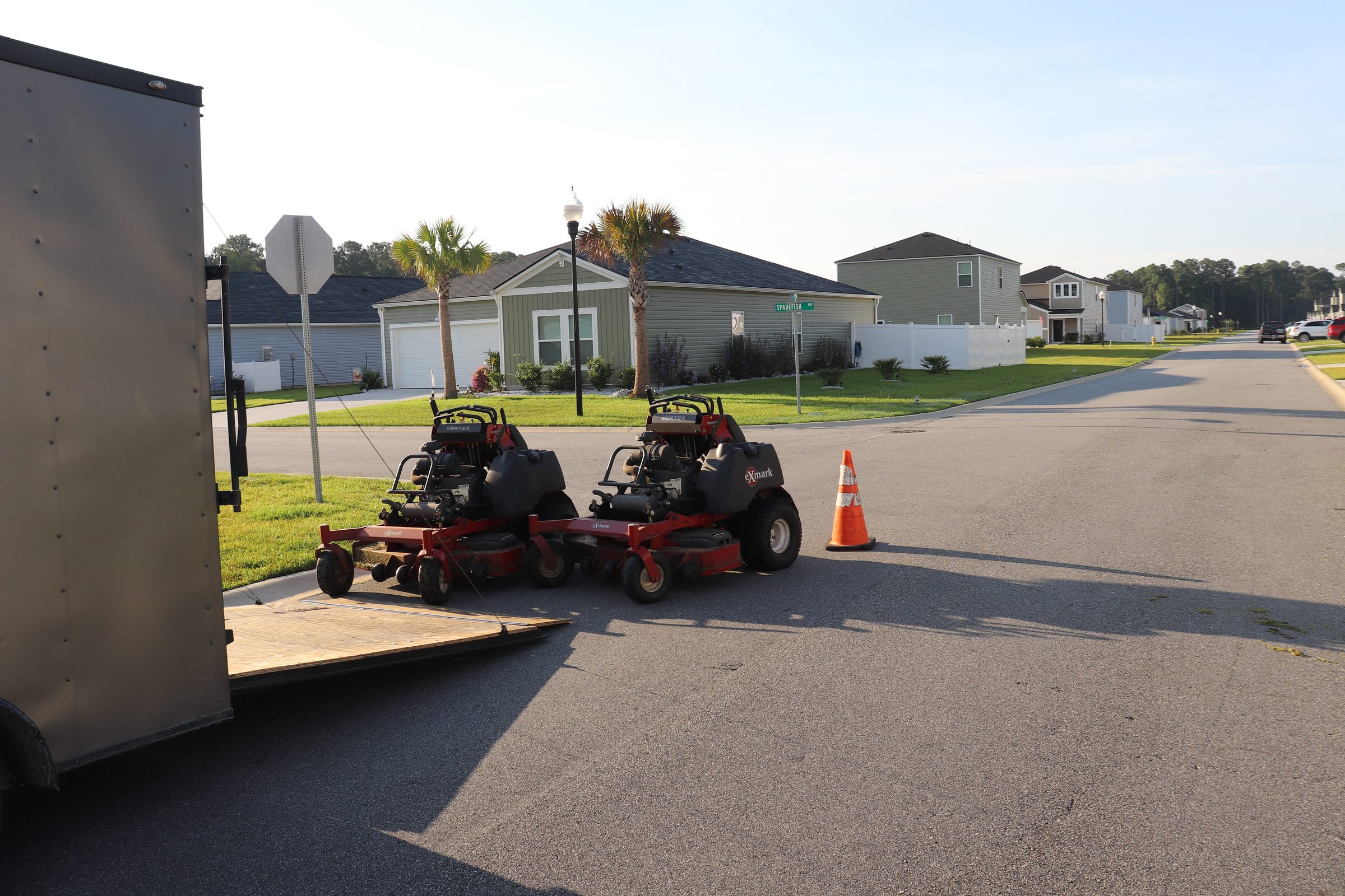 Lawn Rescue Co. commercial mowers loaded on the trailer