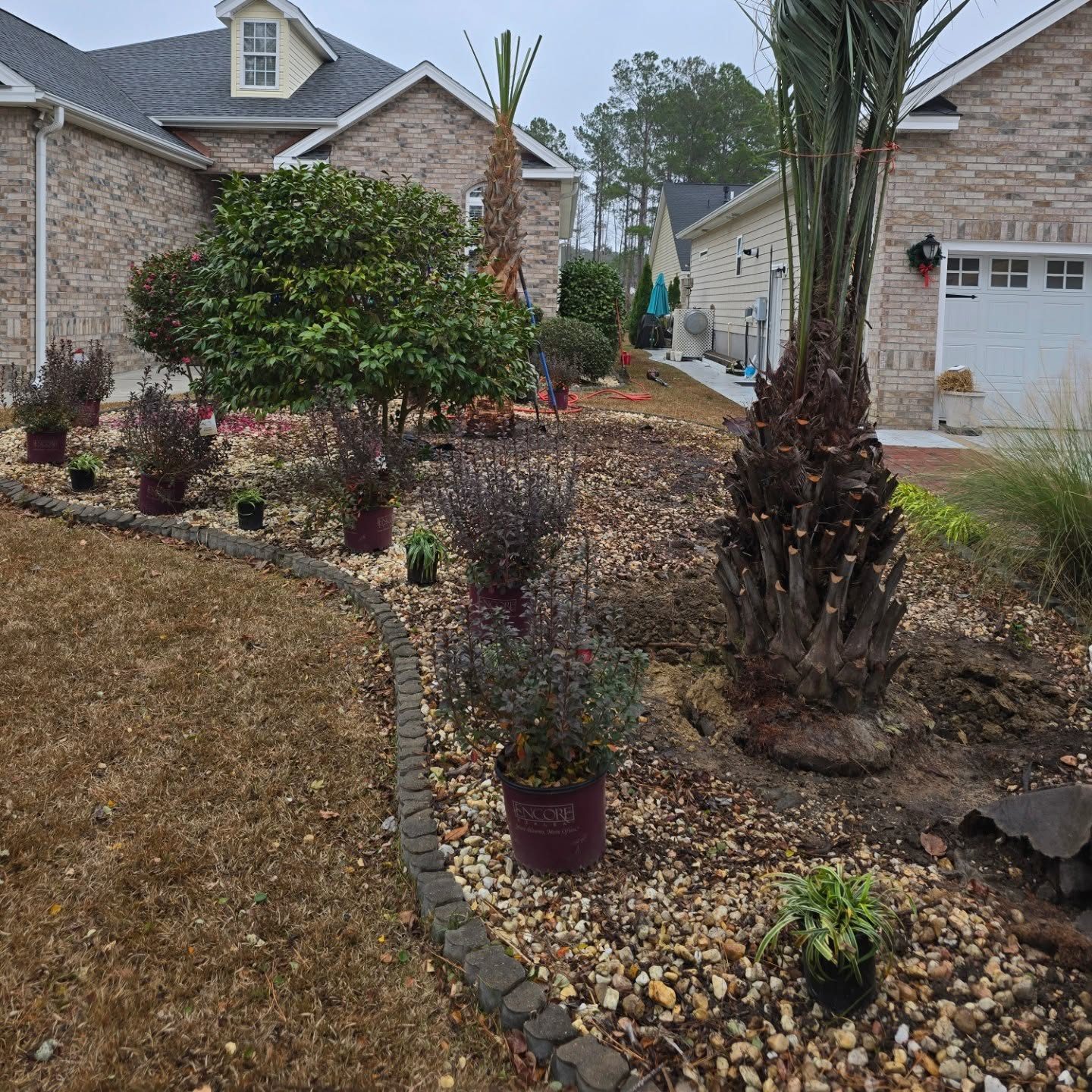 Freshly refreshed landscape bed around a home