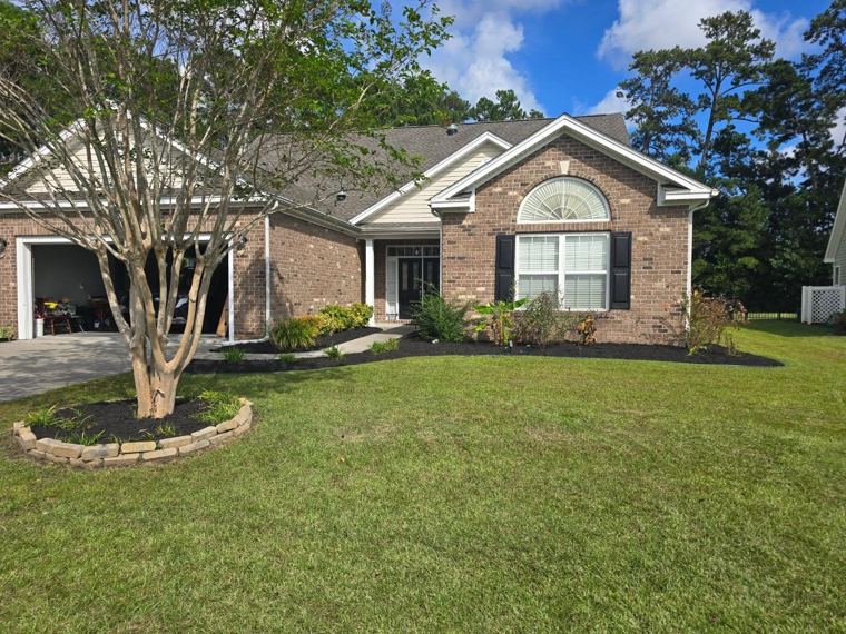 Brick home, fresh cut lawn